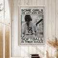 Softball framed wall art displayed on a light wood paneled wall in a warm home setting