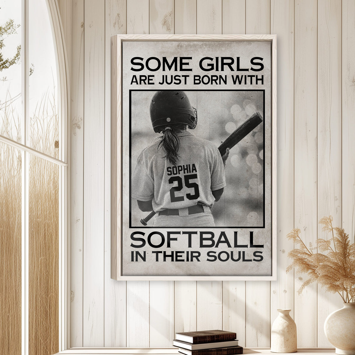 Softball framed wall art displayed on a light wood paneled wall in a warm home setting