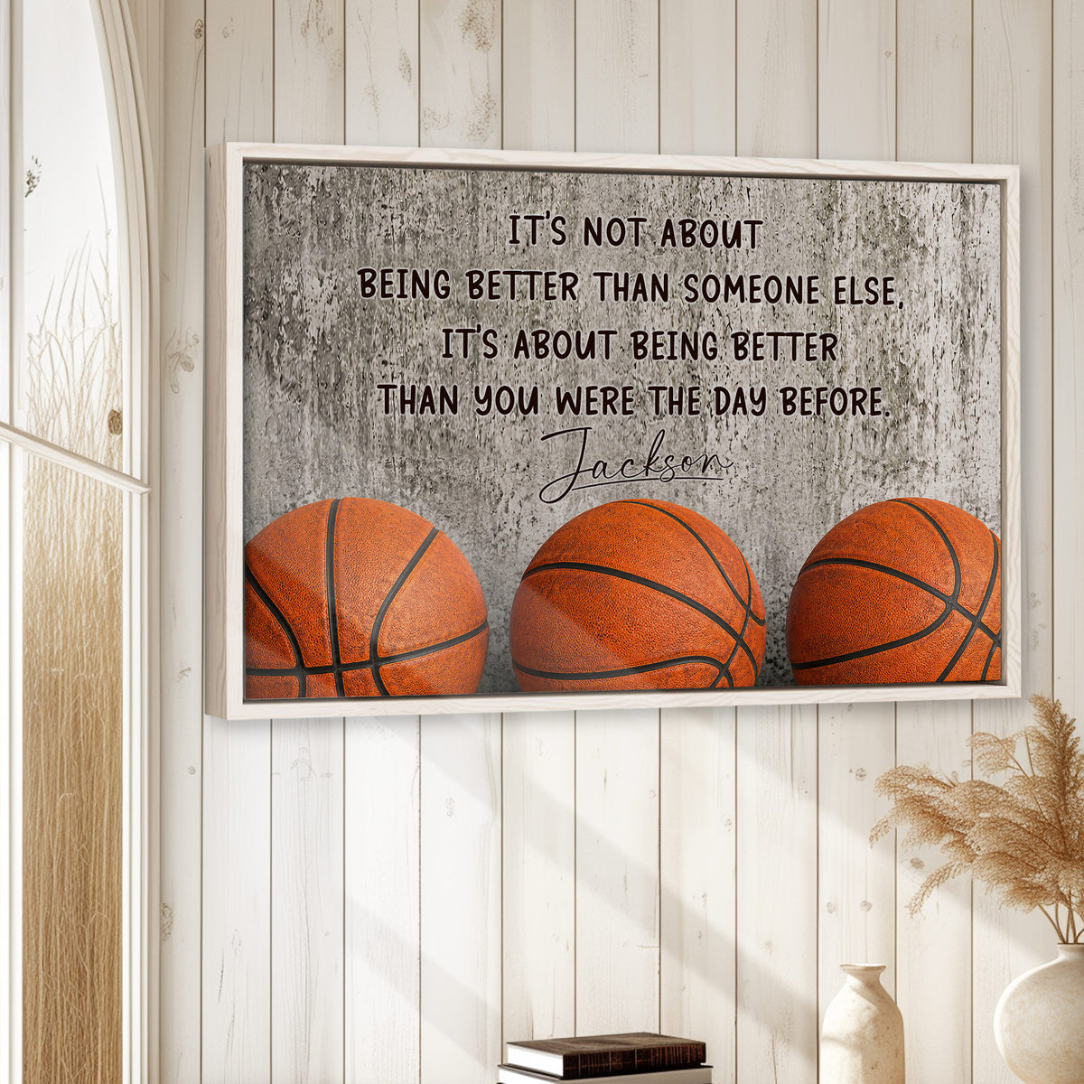 Basketball wall art displayed on a light wood-paneled wall in a bright home interior