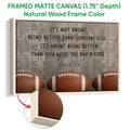 Natural wood framed football wall art with three footballs and a motivational design