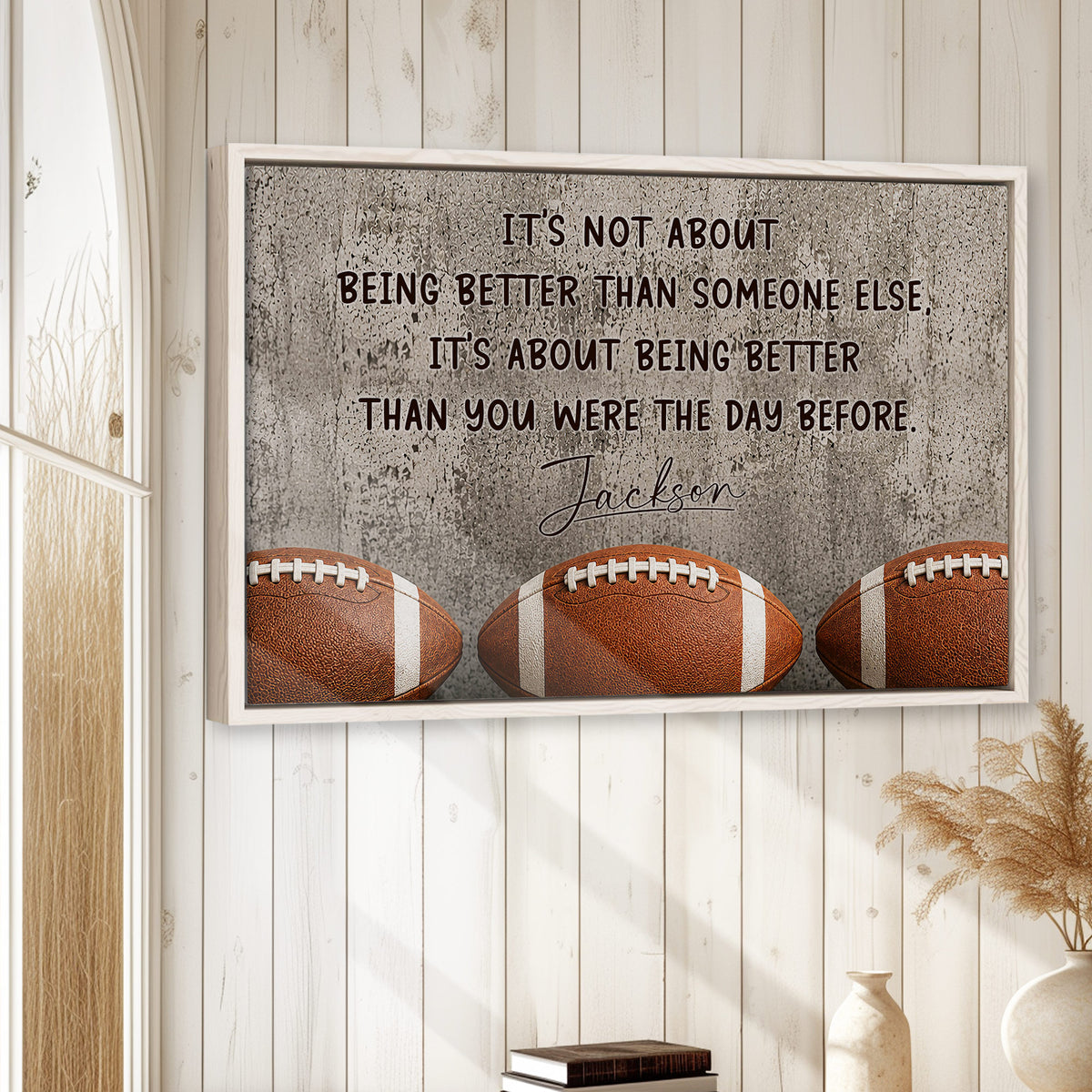 Football wall art displayed in a bright room with white wood paneling and natural wood framing