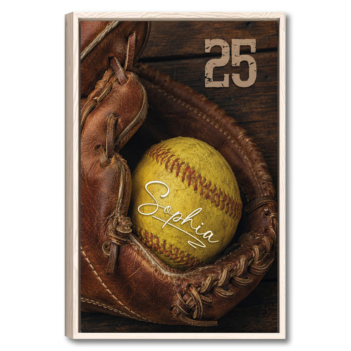 Framed softball wall art featuring a yellow softball in a leather glove against a dark wood background