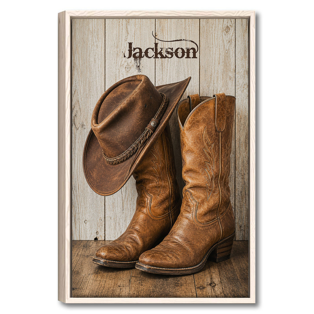 Framed cowboy wall art featuring a western hat and leather boots against a rustic wood backdrop