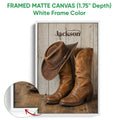White framed cowboy canvas wall art featuring a western hat and leather boots