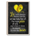 Framed softball wall art featuring a yellow heart-shaped softball and motivational sports quote