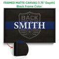 Black framed canvas police wall art with a blue stripe and badge emblem