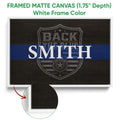 White framed canvas police wall art with a blue stripe and shield badge design