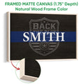 Natural wood framed police wall art with a blue stripe and dark shield badge