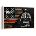 Framed firefighter wall art featuring a firefighter, axe, stars, and a distressed red line flag design
