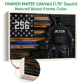 Natural wood framed police wall art with a tactical officer and distressed patriotic blue line flag