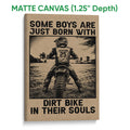 Matte canvas motocross wall art featuring a rear view of a dirt bike rider on a rugged track