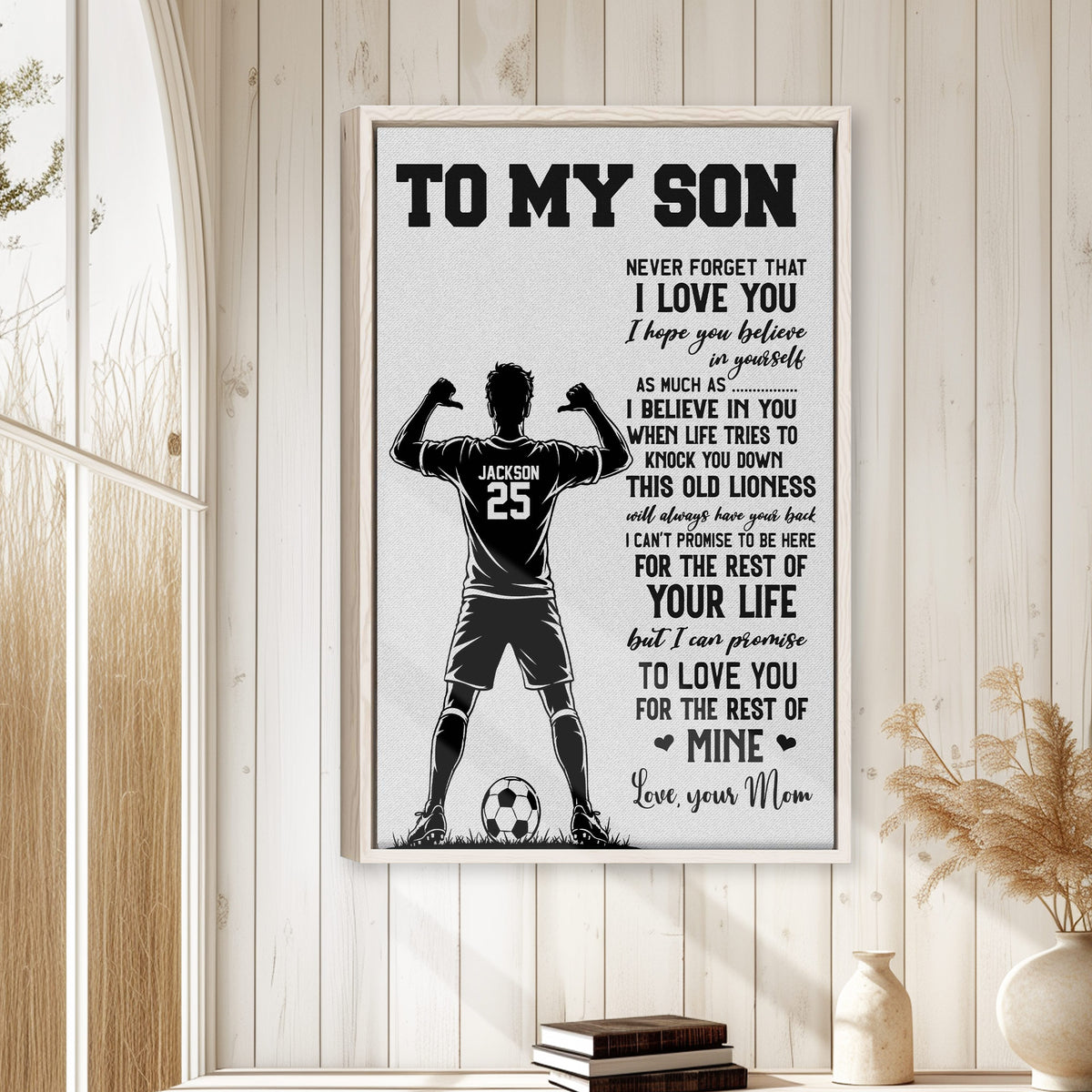 Soccer wall art displayed in a bright home with a wood frame, player silhouette, and soccer ball