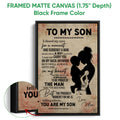 Black framed basketball canvas wall art with a mother and son silhouette and close-up textured artwork detail