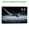 Matte canvas hockey wall art showing a hockey stick and puck on a frozen rink