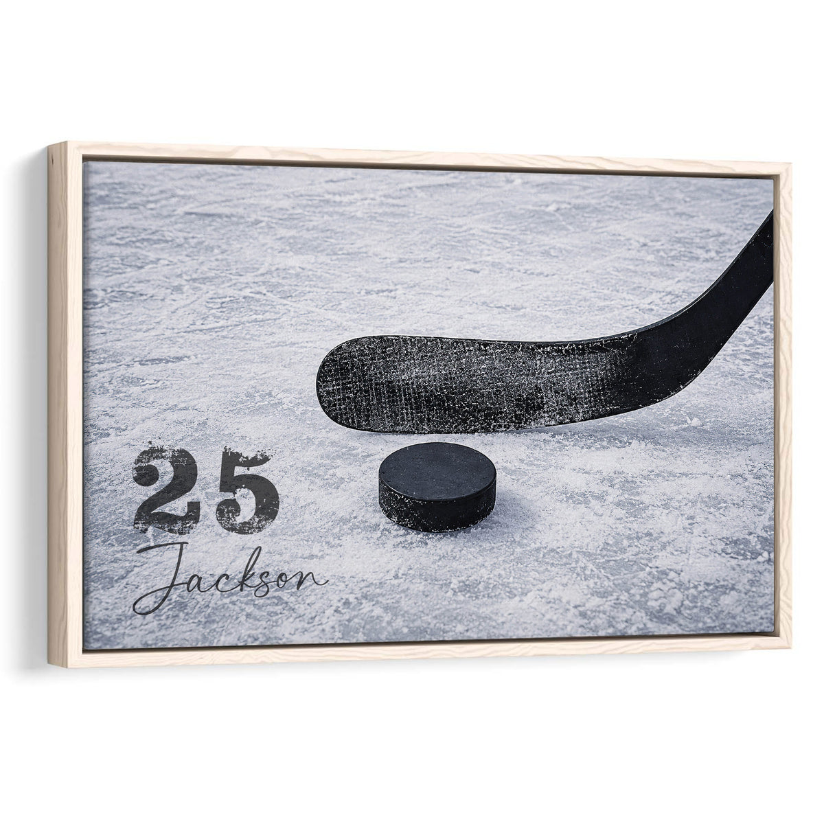 Framed hockey wall art featuring a black stick and puck on textured blue ice