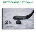 Matte canvas hockey wall art featuring a black stick and puck on blue textured ice