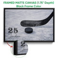 Black framed canvas hockey wall art with a stick and puck detail on an ice background
