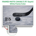 White framed canvas hockey wall art featuring a black stick and puck on textured ice
