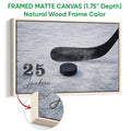 Natural wood framed hockey wall art with a black stick and puck on blue ice