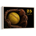 Framed softball wall art featuring a yellow softball in a brown leather glove against a black background