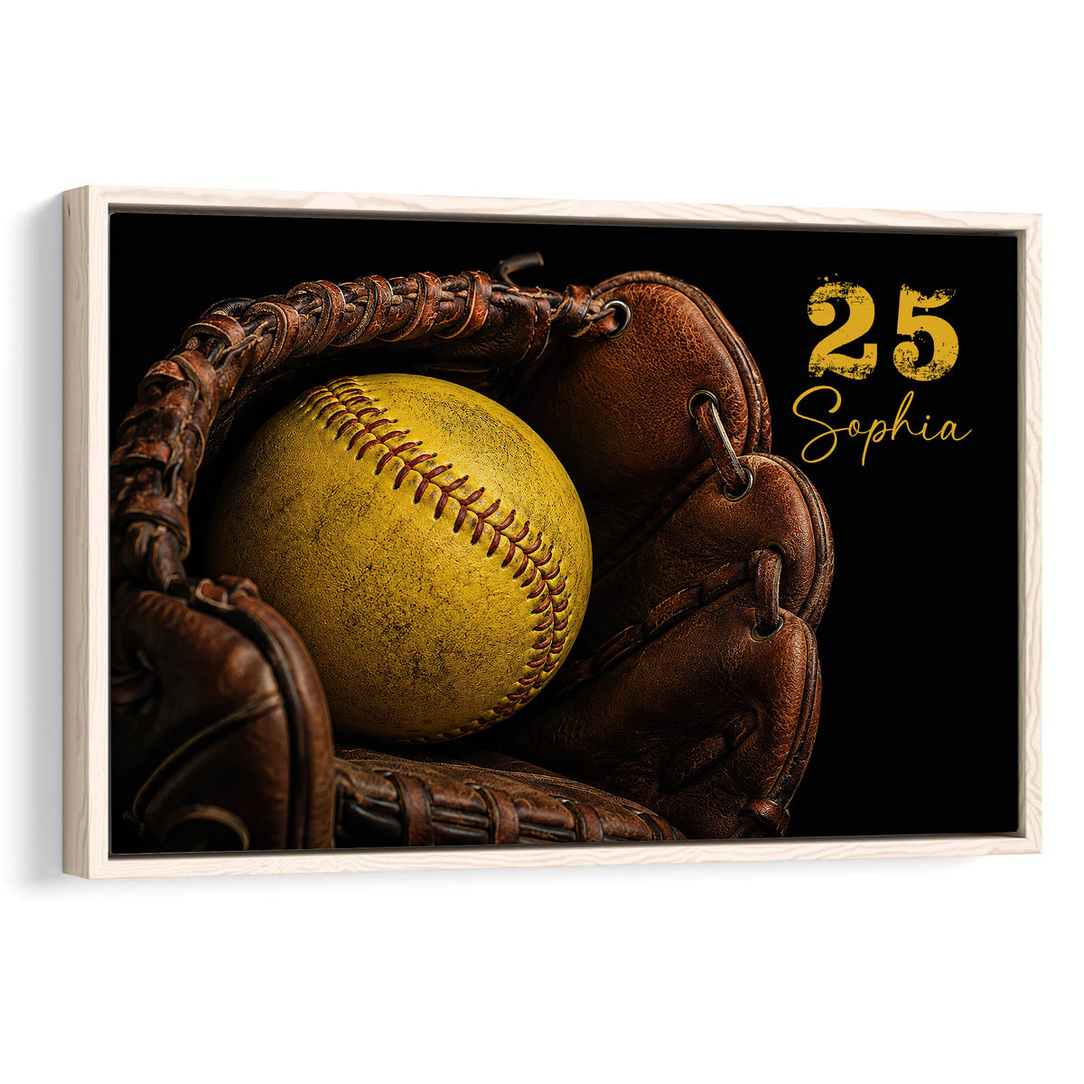 Framed softball wall art featuring a yellow softball in a brown leather glove against a black background