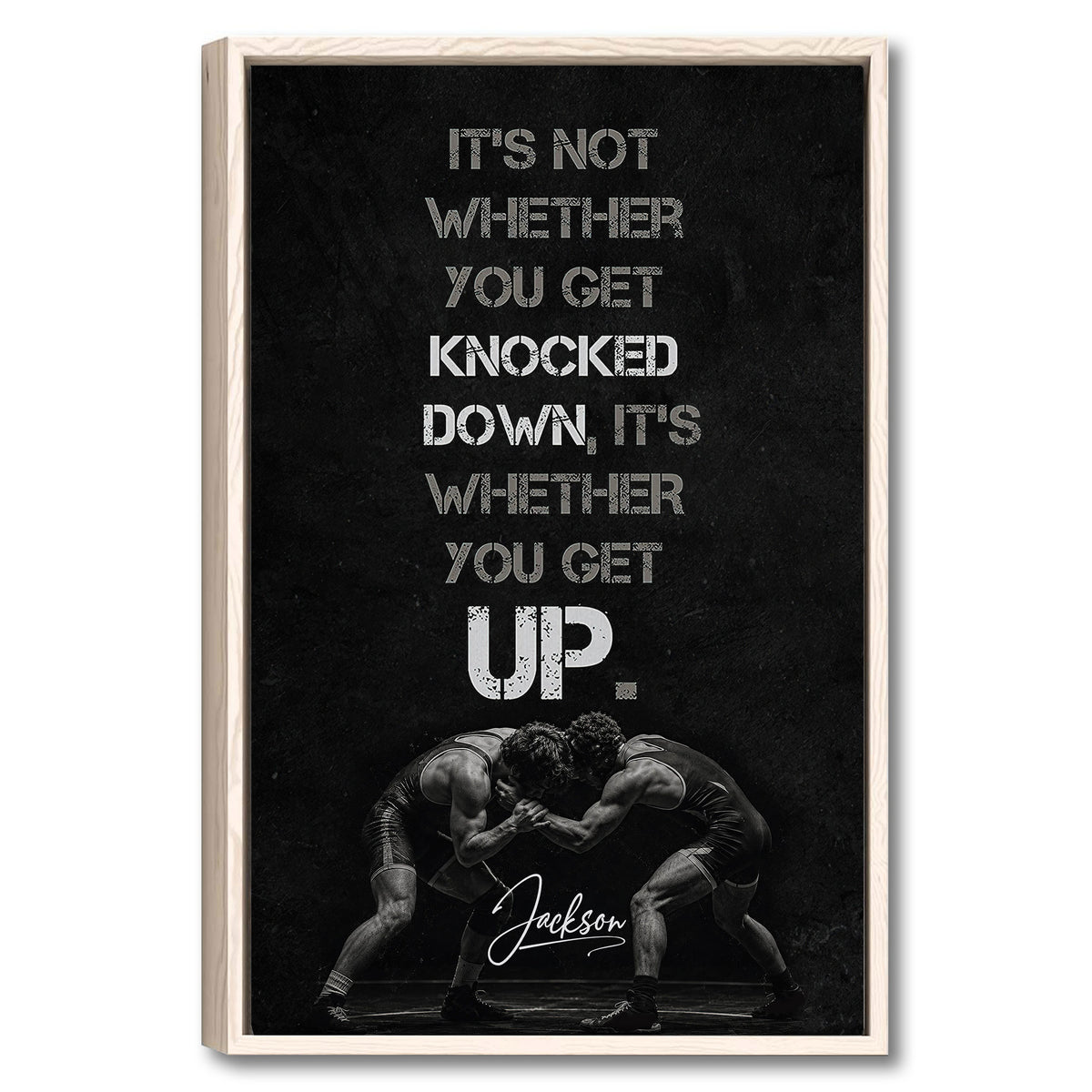 Framed wrestling wall art with two wrestlers grappling beneath a bold motivational design