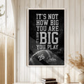 Football wall art displayed in a bright room with wood paneling, neutral decor, and a natural frame