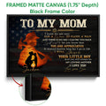 Black framed firefighter canvas wall art with a mother and child silhouette and patriotic star background