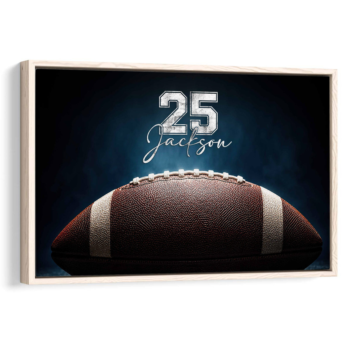 Framed football wall art featuring a close-up football against a dramatic dark blue background