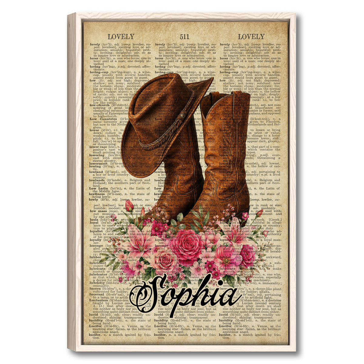 Framed cowboy wall art featuring a brown western hat and boots with pink flowers over vintage dictionary pages