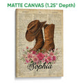 Matte canvas cowboy wall art featuring brown western boots, a cowboy hat, flowers, and aged dictionary text
