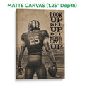 Matte canvas football wall art showing a sepia player and stadium scene with a textured finish