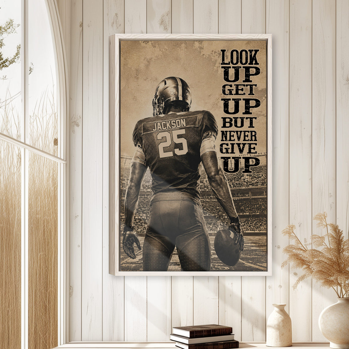 Football wall art displayed in a bright home interior with white paneled walls and natural decor