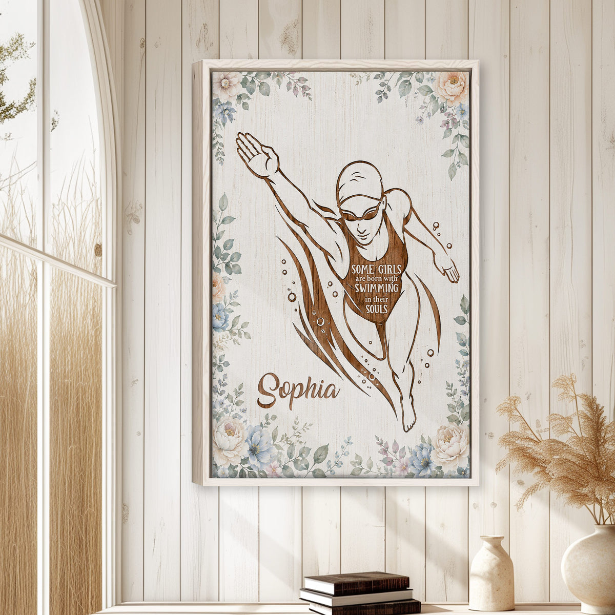 Swimming wall art displayed on a bright white paneled wall in a calm home interior