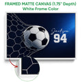 White framed soccer canvas wall art featuring a dramatic ball and net design in blue, black, and white