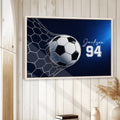Soccer wall art displayed in a bright room with white wood walls and a natural wood frame