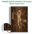 White framed canvas basketball wall art featuring a player dunking on a woodgrain court