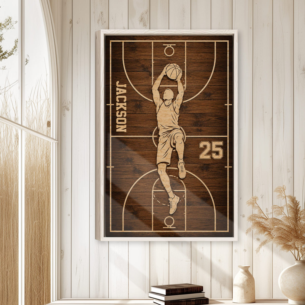 Framed basketball wall art displayed on a light wood paneled wall in a relaxed home setting