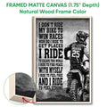 Natural wood framed motocross wall art featuring a helmeted dirt bike rider and dramatic black-and-white design