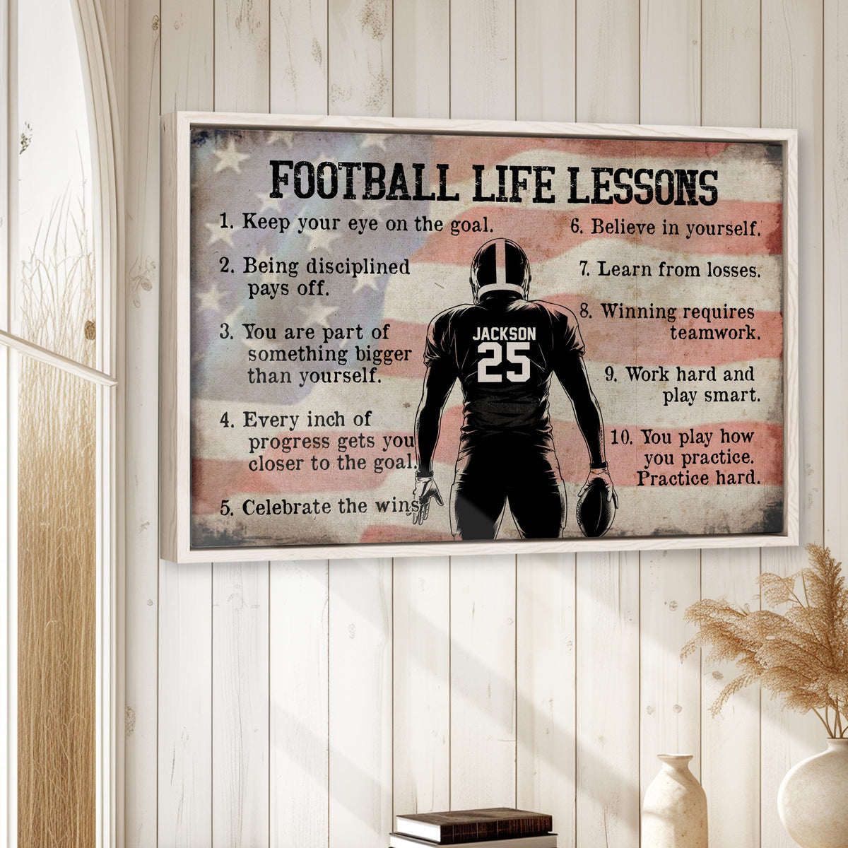 Framed football motivational wall art displayed on a light wood-paneled wall in a bright home setting