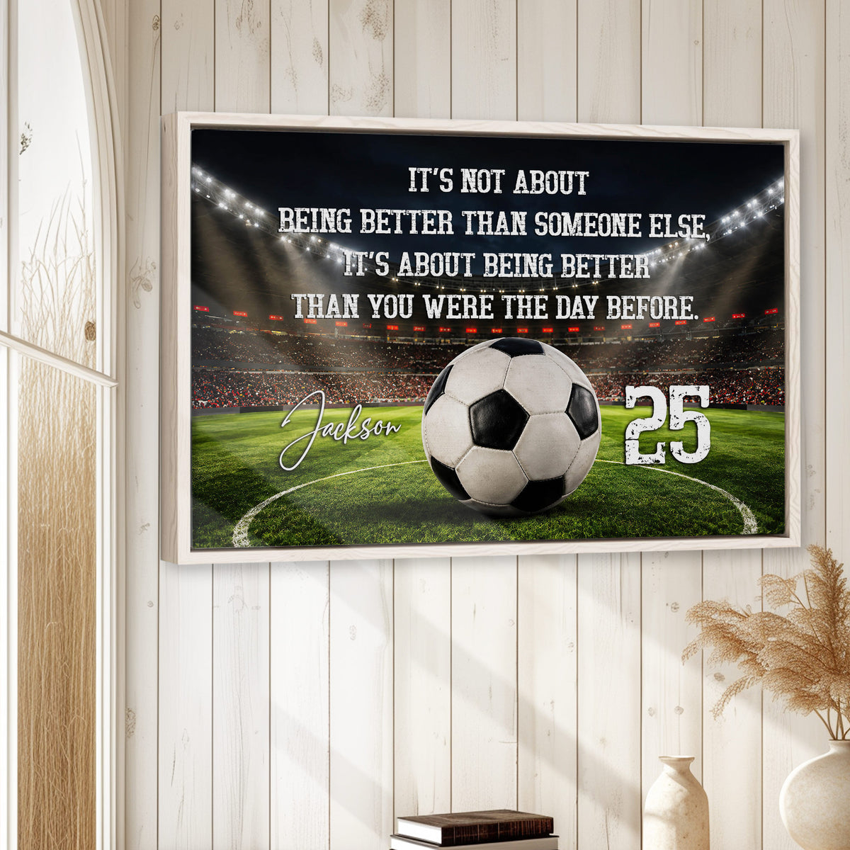 Framed soccer wall art displayed on a light wood accent wall in a bright home setting