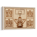 Framed basketball wall art with a player, hoop, and motivational sports design in warm wood tones