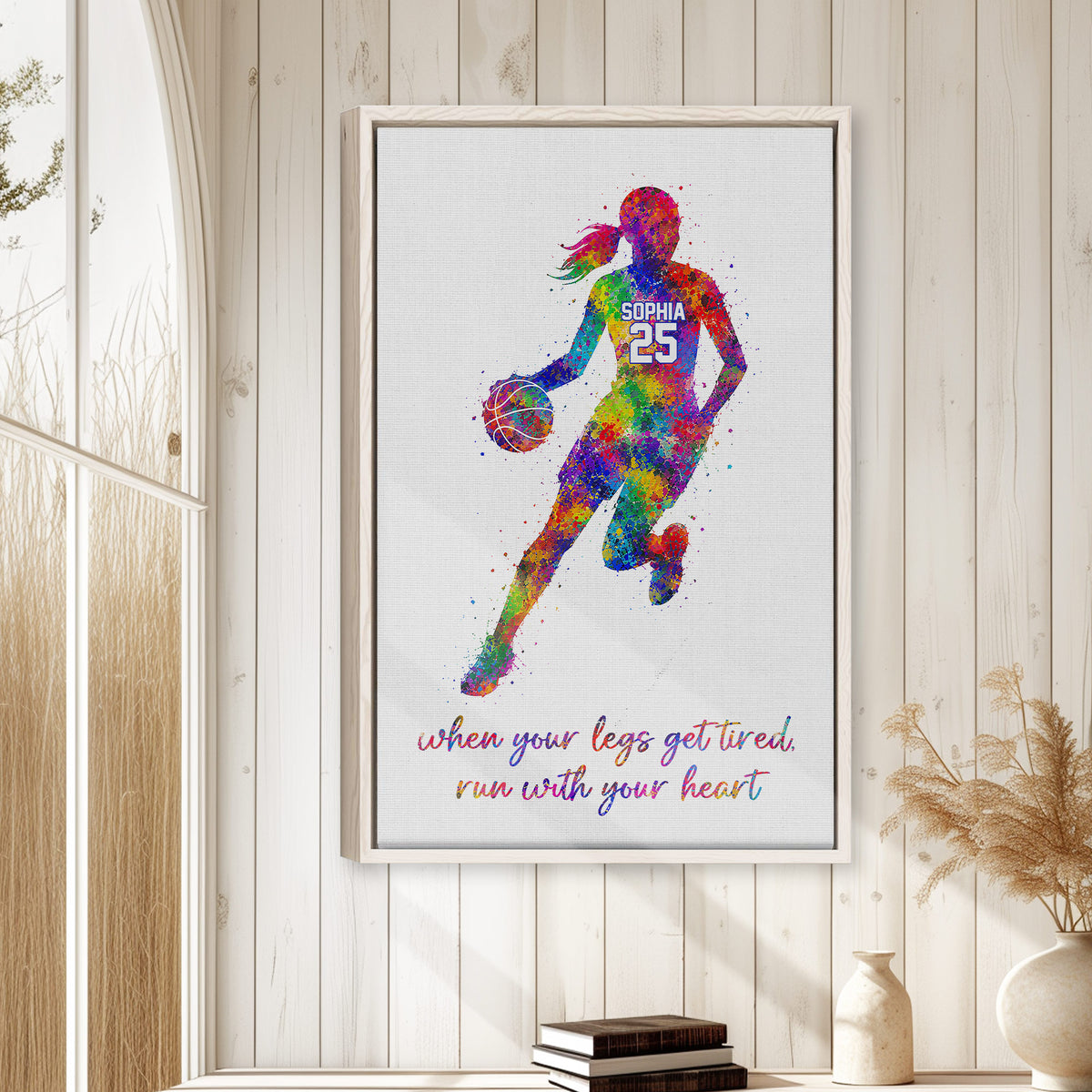 Colorful framed basketball wall art displayed on a bright wood-paneled wall in a home setting