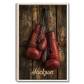 Framed boxing wall art featuring red and black gloves against a rustic wood background