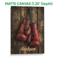 Matte canvas boxing wall art featuring red gloves and a rustic wood background