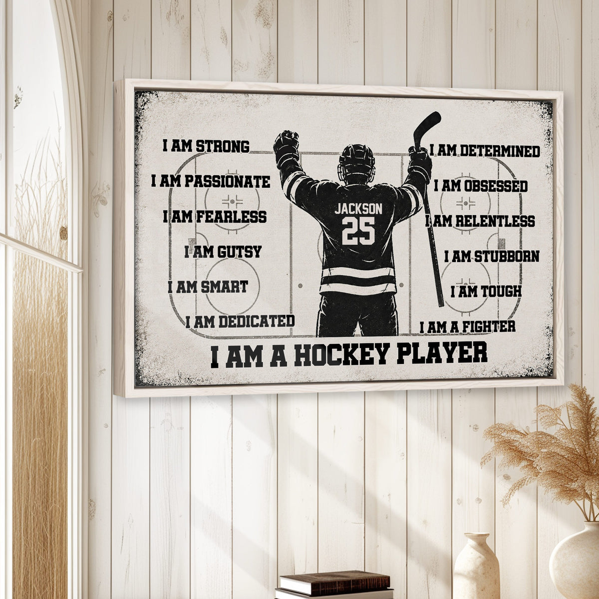 Framed hockey player wall art displayed in a bright room with white wood paneling