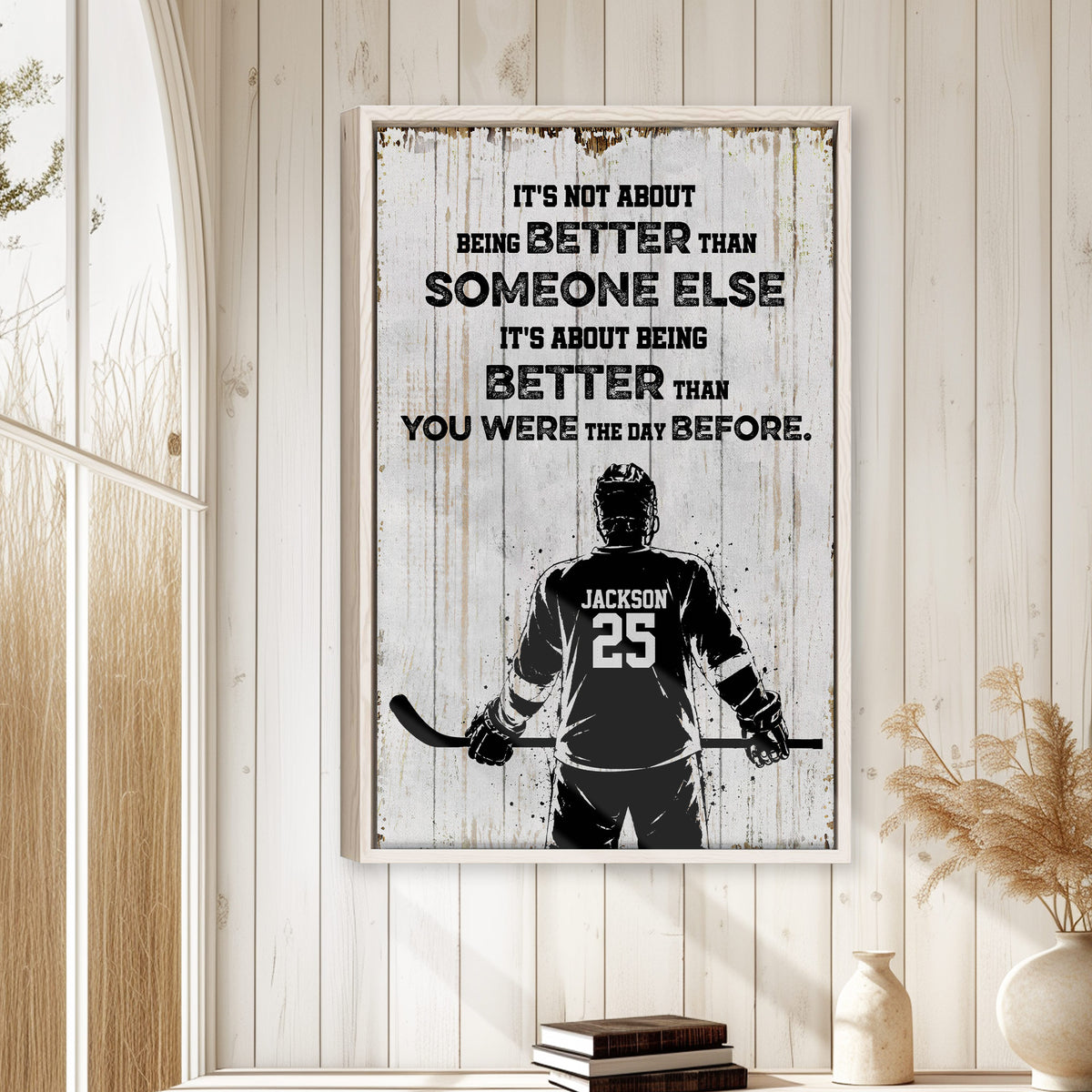 Framed hockey wall art displayed on a light wood-paneled wall in a cozy home interior