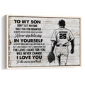 Framed baseball wall art featuring a player silhouette, glove, and inspirational message on a weathered wood background