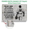 White framed baseball canvas wall art featuring a player silhouette, glove, and rustic inspirational design