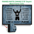 Framed hockey canvas wall art in a black frame with rink markings and player silhouette